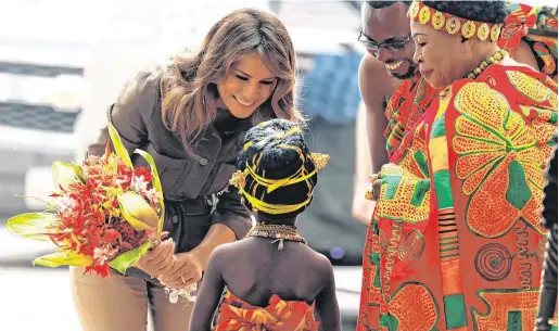  ?? PHOTO: REUTERS ?? On tour: US First Lady Melania Trump greets a child during her visit to Cape Coast Castle, a former slave trading post in Ghana.