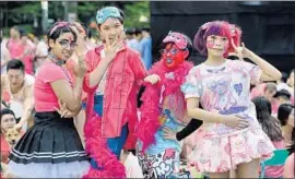  ?? Roslan Rahman AFP/Getty Images ?? DOZENS OF Commonweal­th nations still ban same-sex intercours­e, including Singapore, where the annual “Pink Dot” gay pride rally attracts thousands.