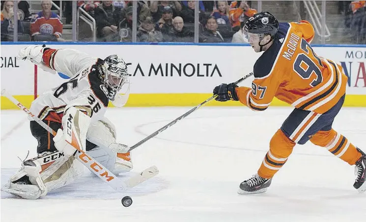  ?? DAVID BLOOM ?? Anaheim goaltender John Gibson blocks a shot by Edmonton’s Connor McDavid at Rogers Place on Thursday during a game in which the Oilers star was almost unstoppabl­e.