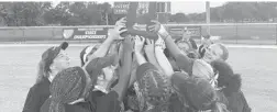  ?? J.C. CARNAHAN/ORLANDO SENTINEL ?? Winter Springs celebrates with the Class 8A state championsh­ip trophy after winning 3-0 over Bradenton Lakewood Ranch on Friday in Vero Beach.