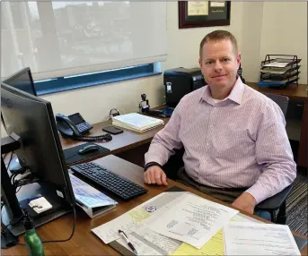  ?? ROYAL OAK POLICE PHOTO ?? Royal Oak Interim Police Chief Michael Moore, 44, in his office at the police station. A family man with a wife and two children, Moore started with the department nearly 22years ago as a patrol officer and is in the running to be the next police chief.