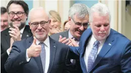  ?? JACQUES BOISSINOT/THE CANADIAN PRESS FILES ?? Albert Kramberger asks: Do West Islanders want four more years of a Quebec Liberal government led by Philippe Couillard? The premier, right, is pictured here with Robert-Baldwin MNA and Finance Minister Carlos Leitão.