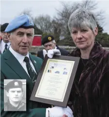  ??  ?? UN Officer Hugo Callaghan presents Pte Armstrong’s widow Gráinne with a framed poem. Inset: Pte Mannix Armstrong.