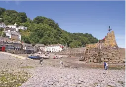  ??  ?? Clovelly’s beach looks friendly when viewed from seaward, but most of it consists of potentiall­y ankle-twisting cobbles and boulders