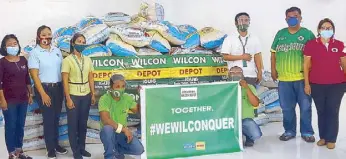  ??  ?? From left (standing): Municipal Social Welfare and Developmen­t officer Remedios Pascual, Municipal Disaster Risk Reduction and Management Office head Susan Daraway, Wilcon Depot Iguig material manager Wilma Tumanguil, operations manager Danilo Avellanoza, Jr., Iguig Municipal Mayor Ferdinand Trinidad and Vice Mayor Juditas Trinidad