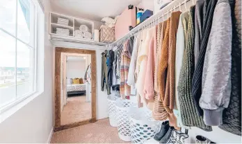  ?? DREAMSTIME ?? A closet organizati­on system is a big part of keeping your home in good order.