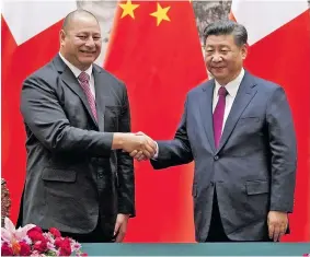  ??  ?? China’s President Xi Jinping greeting Tonga’s King Tupou VI during his state visit to China on March 1, 2018.