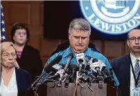  ?? Steven Senne/Associated Press ?? Maine State Police Col. William Ross, center, Maine Gov. Janet Mills, left, and Maine Commission­er of Public Safety Mike Sauschuck discuss the shootings Thursday.