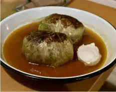  ?? ?? Apteka's golabki — savoy cabbage stuffed with buckwheat and mushrooms in a savory tomato broth.