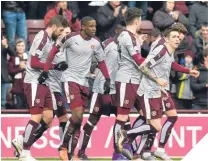  ??  ?? Hearts’ Arnaud Djoum celebrates his goal.