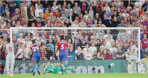  ?? — Reuers ?? Liverpool’s James Milner scores their first goal from the penalty spot.