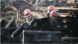  ?? Chinatopix / the asociate d pres ?? China has been admitted into the governing elite of the world’s financial system. Above, Chinese coal miners.