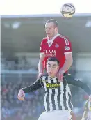  ??  ?? Fight for possession Aberdeen’s Andrew Considine rises above Sean Kelly and, pictured far right, St Mirren’s Gregg Wylde (left) battles with Willo Flood