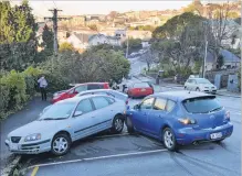  ?? PHOTO: GERARD O’BRIEN ?? No entry . . . Police closed Heriot Row in central Dunedin yesterday morning after four crashes.