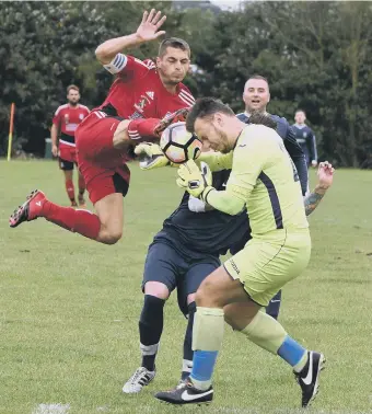  ??  ?? Railway Club’s keeper comes under pressure as Southwick attack in last week’s cup tie.