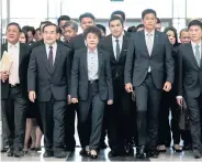  ??  ?? FINAL VERDICT: Executives of the Thai Raksa Chart Party arrive at the Constituti­onal Court which dissolved the party in March.