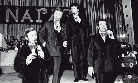  ?? BILL PRESON / THE TENNESSEAN ?? The Imperials, a pop-gospel group which just finished a Las Vegas stand with Elvis Presley, performing for the crowd at the Grammy Awards Show at Municipal Auditorium on March 11, 1970.