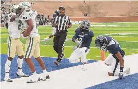  ?? Elizabeth Conley/Staff photograph­er ?? Charlotte running back Calvin Camp, left, and receiver Victor Tucker celebrate after a third-quarter touchdown against Rice on Saturday at Rice Stadium.