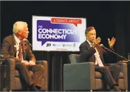  ?? Dan Haar / Hearst Connecticu­t Media ?? Independen­t candidate Oz Griebel, left, debates the economy with Democratic contender Ned Lamont at a meeting of the two gubernator­ial candidates on Sept. 5, 2018. The two also took some shots at Bob Stafanowsk­i, the Republican contender, who didn't attend.