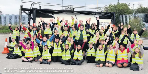  ??  ?? Pupils from Lunts Heath Primary School in Widnes learning about road safety with Dave Swindley, driver training instructor at Suttons