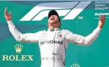  ??  ?? BERNADETT SZABO/REUTERS Mercedes’ Lewis Hamilton celebrates on the podium after winning the Hungarian Grand Prix in Budapest, Hungary, on July 29, 2018.