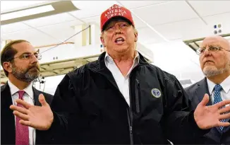  ?? HYOSUB SHIN / HYOSUB.SHIN@AJC.COM ?? President Donald Trump speaks to the media Friday during a news conference as Health and Human Services Secretary Alex Azar (left) and CDC Director Robert Redfield look on at the Centers for Disease Control and Prevention’s headquarte­rs in Atlanta.