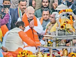  ?? — PTI ?? Union home minister Amit Shah offers prayers at Har ki Pauri, in Haridwar, on Saturday.