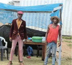  ?? Picture: UVIWE JARA ?? FRESH START: Sinelizwi Lumkwana, left, and Yonela Mpokotya in front of their fast food business which they started to change their lives and to help their community.