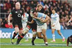  ?? AP ?? Argentina’s Agustin Creevy is tackled by England’s Chris Robshaw during their math at Twickenham stadium.