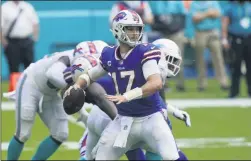  ?? LYNNE SLADKY ?? Buffalo Bills quarterbac­k Josh Allen (17) looks to pass, during the second half of an NFL football game against the Miami Dolphins, Sunday, Sept. 20, 2020, in Miami Gardens, Fla.