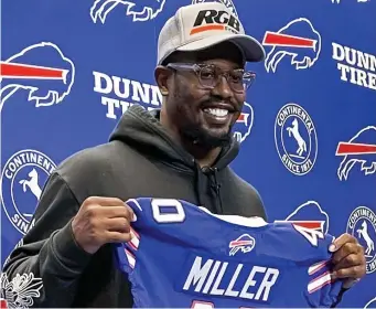  ?? Ap file ?? BIG JOLT TO PASS RUSH: Von Miller holds up a Buffalo Bills jersey during a news conference on March 17.