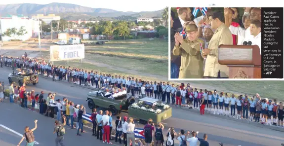  ?? — Reuters — AFP ?? People watch the cortege carrying the ashes of Fidel Castro drive towards Santa Ifigenia cemetery in Santiago de Cuba on Sunday. President Raul Castro applauds next to Venezuelan President Nicolas Maduro during the last ceremony to pay homage to Fidel...