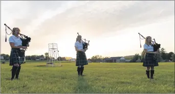  ?? SUBMITTED PHOTO -
JOHN ZANGARI, KU ?? The Kutztown Pipe Band rehearses socially distanced from one another during practice on Kutztown University’s campus on
Sept. 9. From left to right, rehearsing are Cathy Reighn, Jennie Friehauf and Rachel Massie.