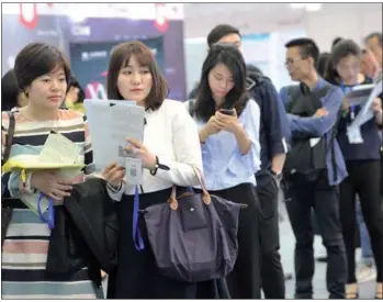  ?? XUAN HUI / FOR CHINA DAILY ?? Overseas returnees scout for jobs at the 16th Conference on Internatio­nal Exchange of Profession­als in Shenzhen, Guangdong province.