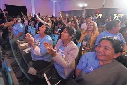  ?? MARK RALSTON/AFP/GETTY IMAGES ?? Immigratio­n rights activists cheer Democratic candidates Friday in Pasadena, Calif.