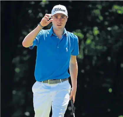  ??  ?? Justin Thomas gestures after making a birdie on the sixth hole.