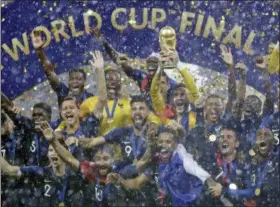  ?? MATTHIAS SCHRADER — THE ASSOCIATED PRESS ?? France goalkeeper Hugo Lloris holds the trophy aloft after the final match between France and Croatia at the 2018 soccer World Cup in the Luzhniki Stadium in Moscow, Russia, Sunday. France won the final 4-2.