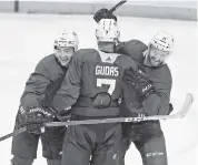  ?? CHARLES TRAINOR JR ctrainor@miamiheral­d.com ?? Florida Panthers Frank Vatrano left, Radko Gudas and Jonathan Huberdeau celebrate the final goal of their scrimmage Tuesday at the BB&T Center in Sunrise.