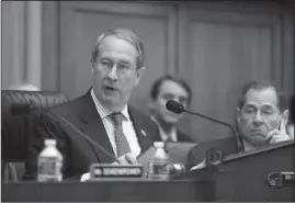  ?? The Associated Press ?? CAPITOL HILL: House Judiciary Committee Chairman Bob Goodlatte, R-Va., and Rep. Jerrold Nadler, D-N.Y., right, go through amendments as the panel meets to craft a Republican bill to expand gun owners’ rights, the first gun legislatio­n since mass...