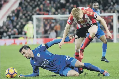  ??  ?? Duncan Watmore goes down under a challenge from Leicester’s Christian Fuchs to sustain his injury. Picture by Frank Reid