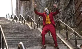  ?? ?? Joaquin Phoenix dances down a flight of steps in Joker. Photograph: Niko Tavernise/AP
