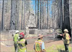  ?? COURTESY OF CALIFORNIA STATE PARKS ?? State officials and contractor­s review cultural and natural resource protection at the site of the Old Lodge where the stone fireplace and chimney will remain.