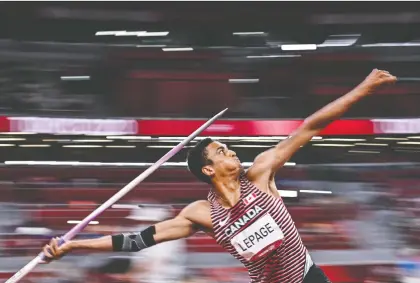  ?? BEN STANSALL/AFP VIA GETTY IMAGES ?? Pierce Lepage tosses the javelin — his most challengin­g event — en route to finishing fifth in his Olympic debut.