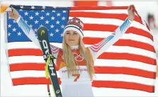  ?? CHRISTOPHE ENA/THE ASSOCIATED PRESS ?? Bronze medal winner Lindsey Vonn of the United States celebrates Wednesday during the flower ceremony for the women’s downhill at the 2018 Winter Olympics in South Korea. With Vonn and Ted Ligety likely on the way out, alpine skiing is heading for a...