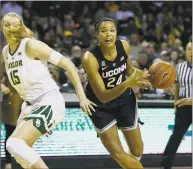  ?? Ray Carlin / Associated Press ?? UConn forward Napheesa Collier ( 24) works her way past Baylor forward Lauren Cox on Thursday.