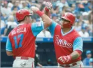  ?? JON BLACKER — THE CANADIAN PRESS VIA AP ?? Philadelph­ia Phillies’ Wilson Ramos, right, celebrates his two-run home run with teammate Rhys Hoskins during the eighth inning of a baseball game against the Toronto Blue Jays, Sunday in Toronto.