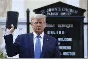  ?? PATRICK SEMANSKY — THE ASSOCIATED PRESS FILE ?? President Donald Trump holds a Bible as he visits outside St. John's Church across Lafayette Park from the White House in Washington on June 1, 2020.