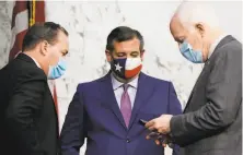  ?? Ken Cedeno / Associated Press ?? Sen. Mike Lee confers with Texas Sens. Ted Cruz and John Cornyn, who blocked President Barack Obama’s court picks.