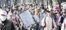  ?? GINNETTE RIQUELME AP ?? Devotees of the Virgin of Guadalupe walk to the Basilica on Sunday to give thanks or worship a day before her national celebratio­n in Mexico City.