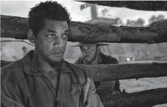  ?? Apple TV+ ?? Will Smith, left, plays the enslaved Peter in this unsparing film. Ben Foster co-stars.